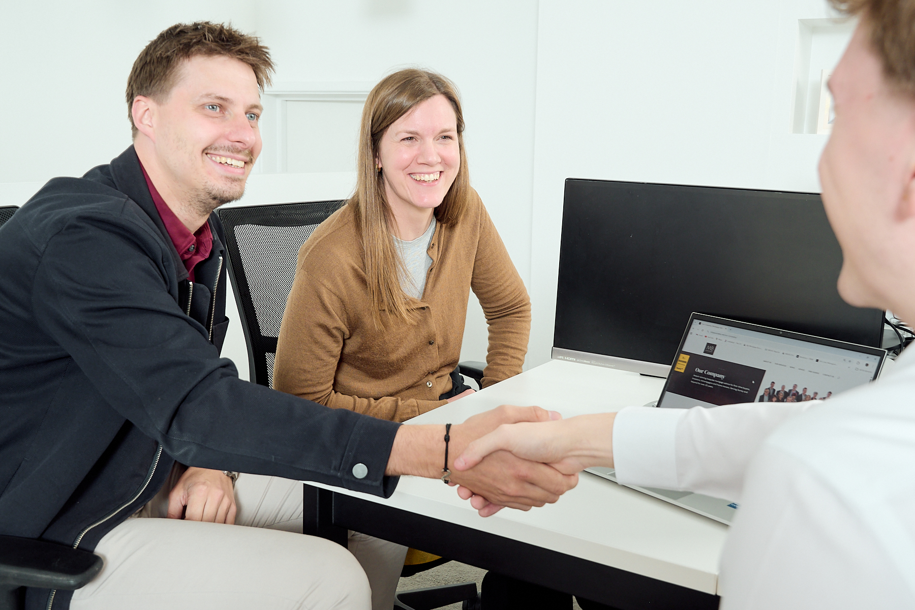 Shaking hands with mortgage broker